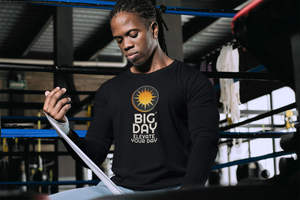 BIG DAY® Men's Long Sleeves - man wrapping hand while wearing BIG DAY Elevate Your Day black long sleeve