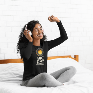 BIG DAY® Women's Long Sleeves - smiling woman wearing headphones while wearing BIG DAY Elevate Your Day black long sleeve