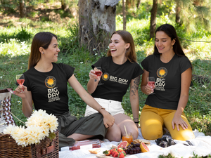 Women's BIG DAY® Apparel & Accessories Collection - three women wearing BIG DAY Elevate Your Day black t-shirts during picnic