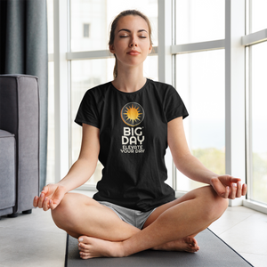 BIG DAY® Women's T-shirts - Woman meditating while wearing BIG DAY Elevate Your Day black t-shirt