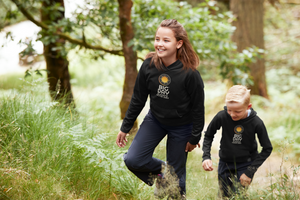 BIG DAY® Kids Apparel & Accessories Collection - two kids hiking while wearing BIG DAY Elevate Your Day black hoodies