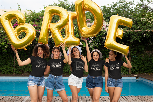 BIG DAY® Wedding / Bachelorette / Bachelor Party Collection - bachelorette party holding up inflatable bride letters while wearing BIG DAY Bachelorette party black t-shirts